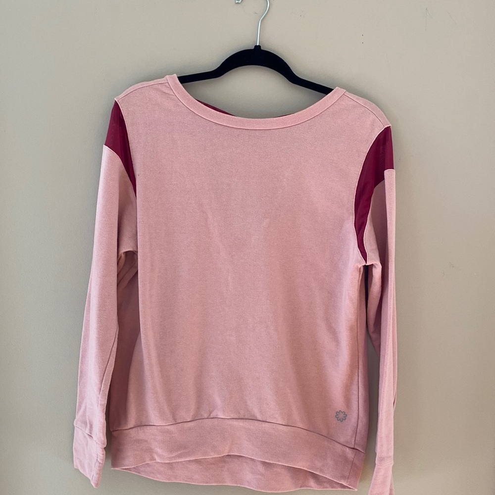 Pink cozy sweatshirt with mesh cross cross back.
